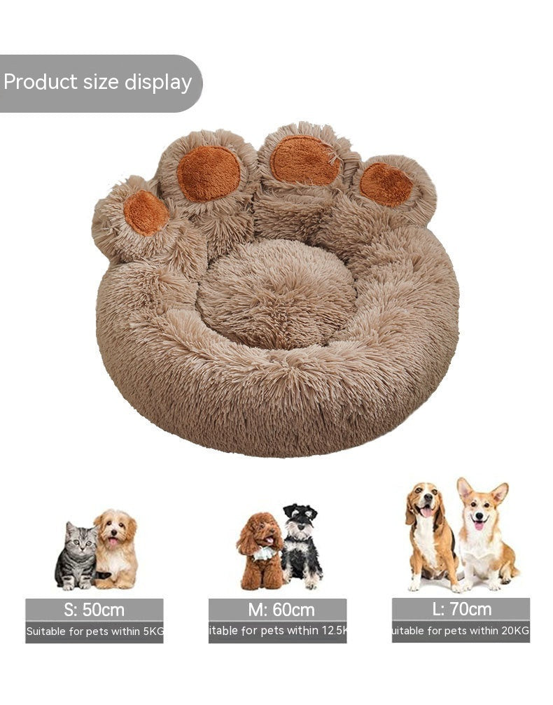 Dog resting comfortably in soft plush cave bed